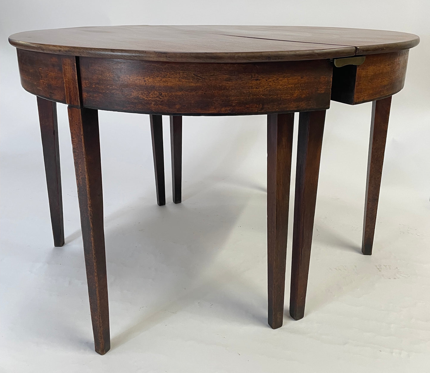 A matching pair of George III Mahogany Demi Lune tables.