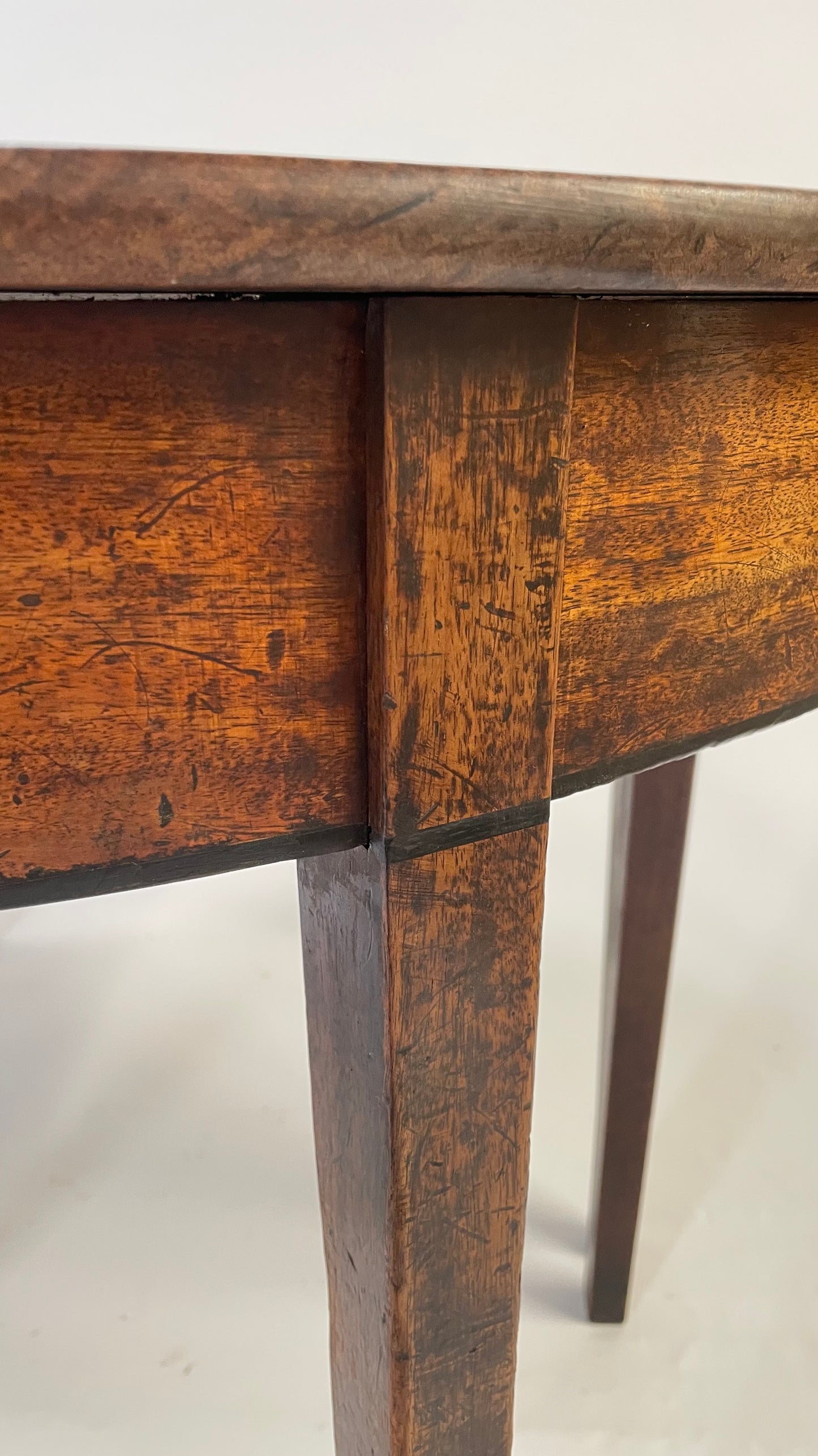 A matching pair of George III Mahogany Demi Lune tables.