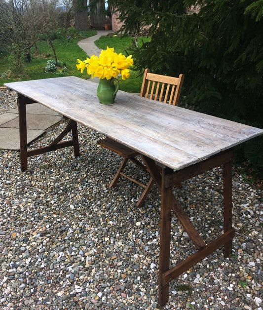 A rustic, vintage church trestle table.