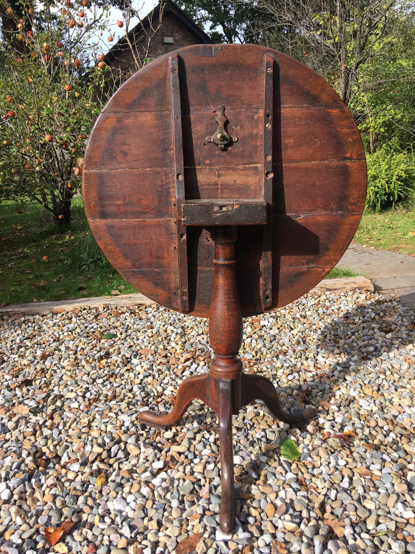 Antique oak tilt top round table